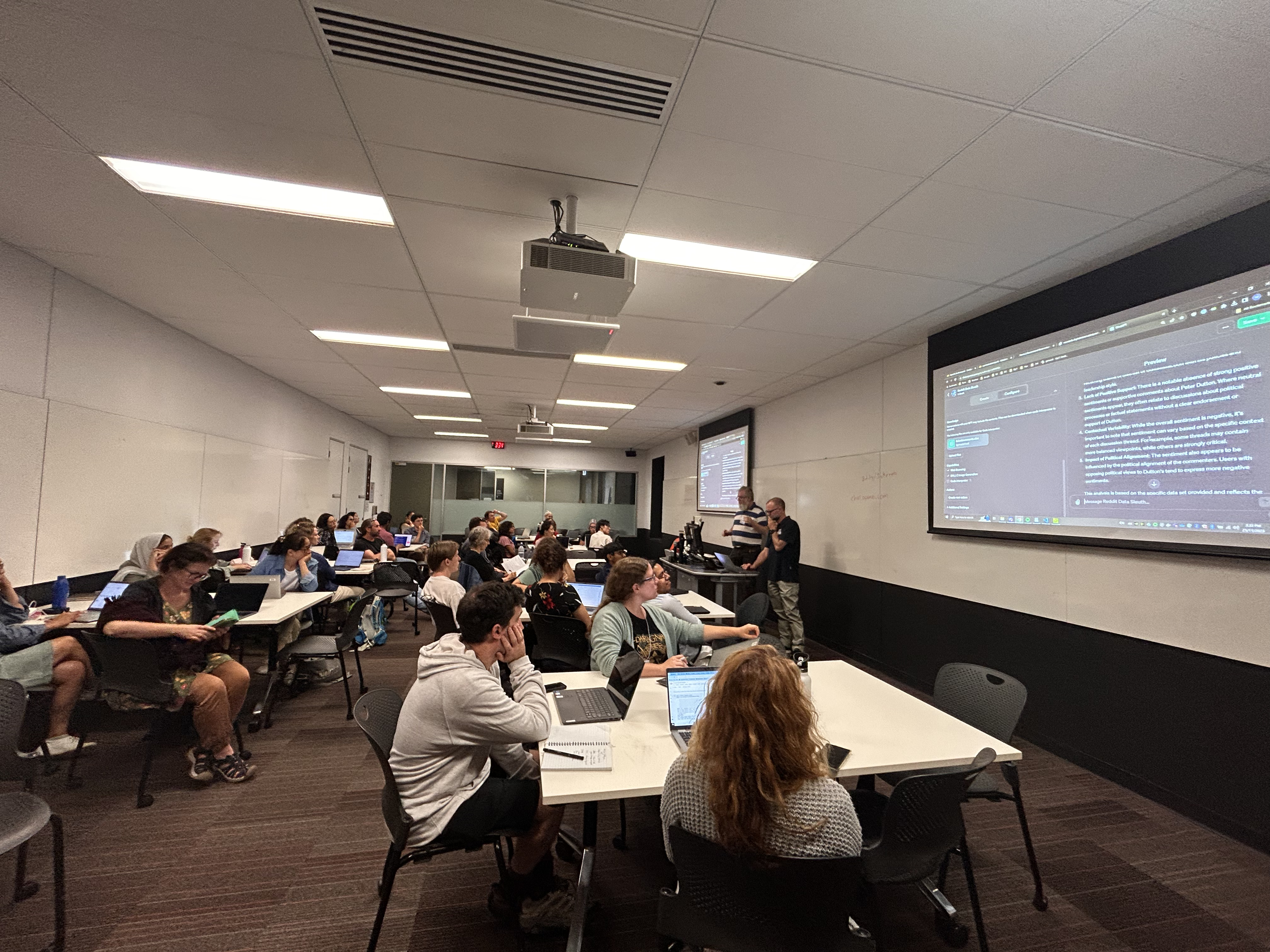 Photo of two men presenting in a room